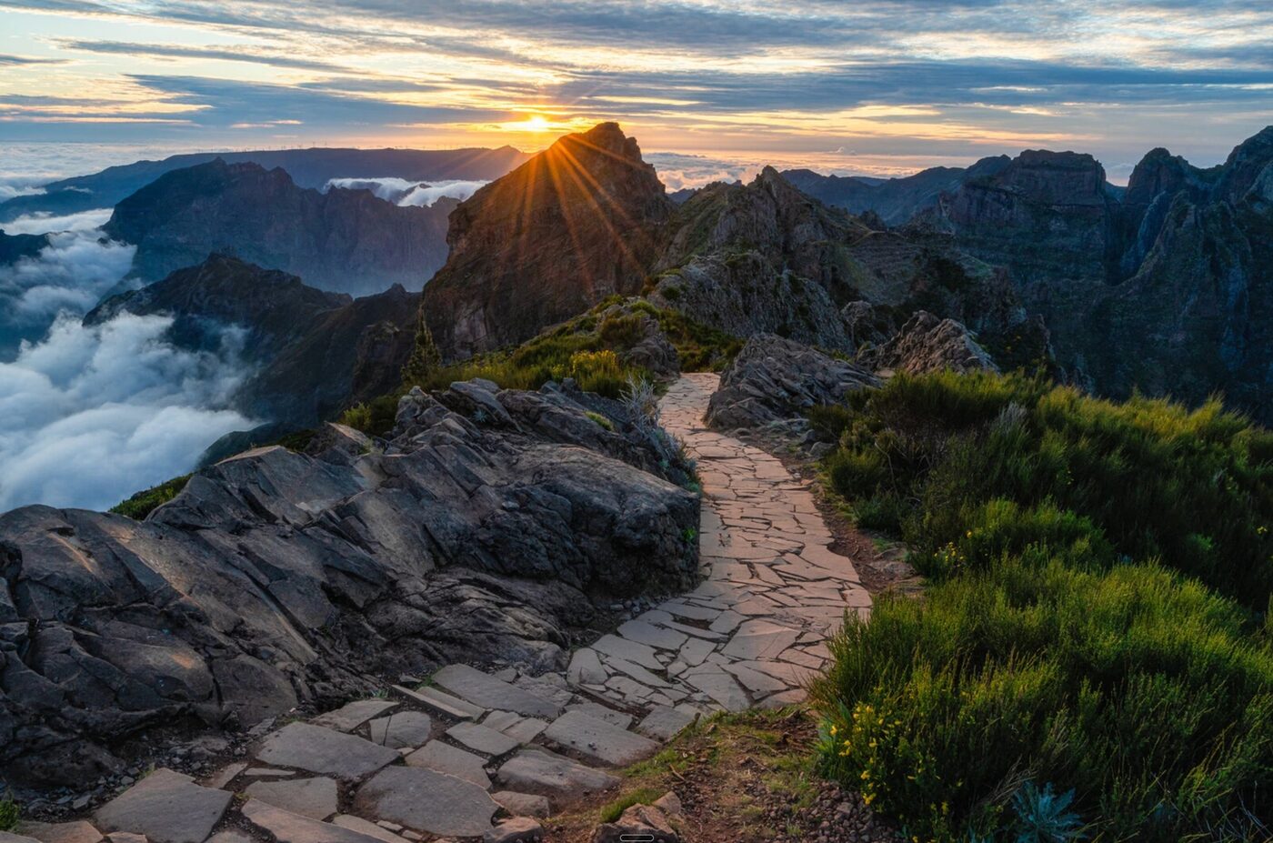 Sunrise over the PR1 trail at Pico do Areeiro, above the clouds